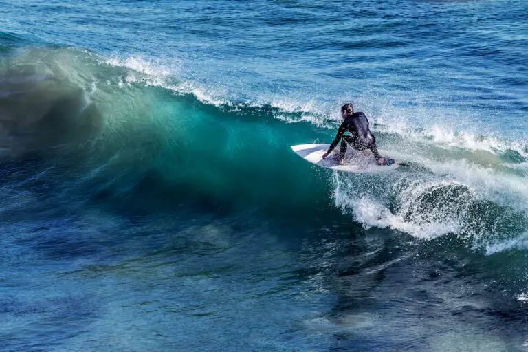 A group of people surfing and paddle boarding on Martha's Vineyard beaches